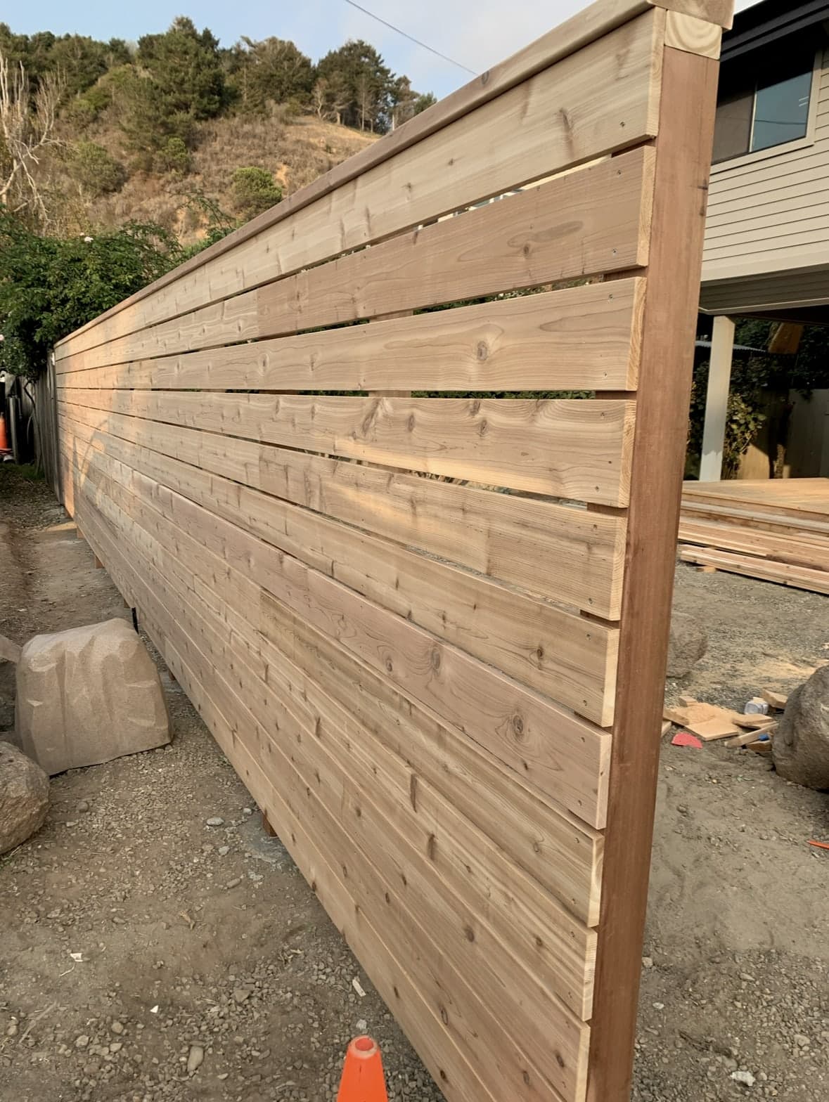 Horizontal wood privacy fence with a clean top cap.